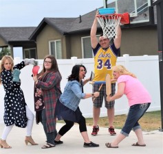 Hubsmith with her sisters, husband and friend when they were on a cooking show together. They called themselves the Food Athletes, doing sports with cooking equipment. RaChelle was boxing her sister with oven mits.